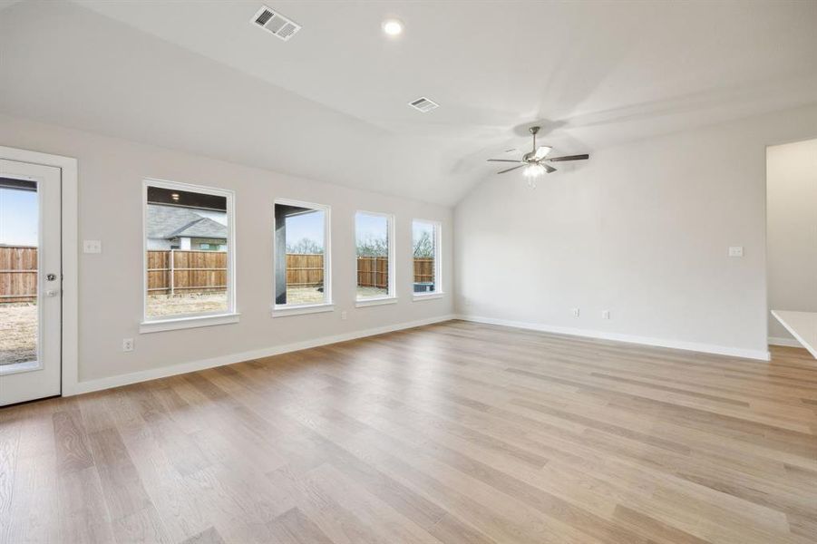 Living room with a wall of windows providing great natural light.