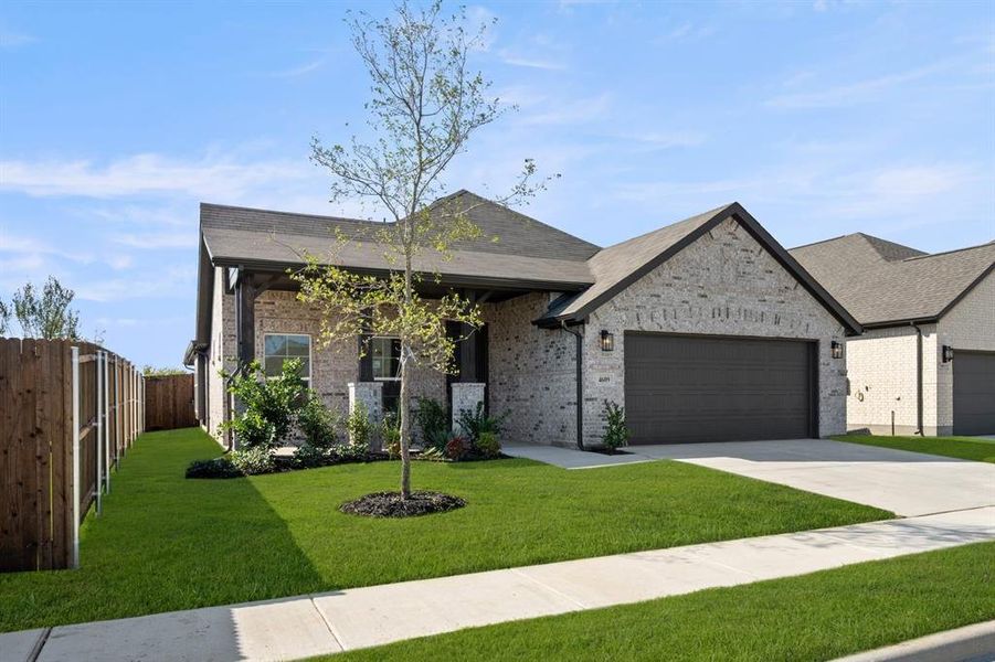Front exterior of a new home in Summer Crest, Fort Worth, TX, highlighting curb appeal (Image 22).