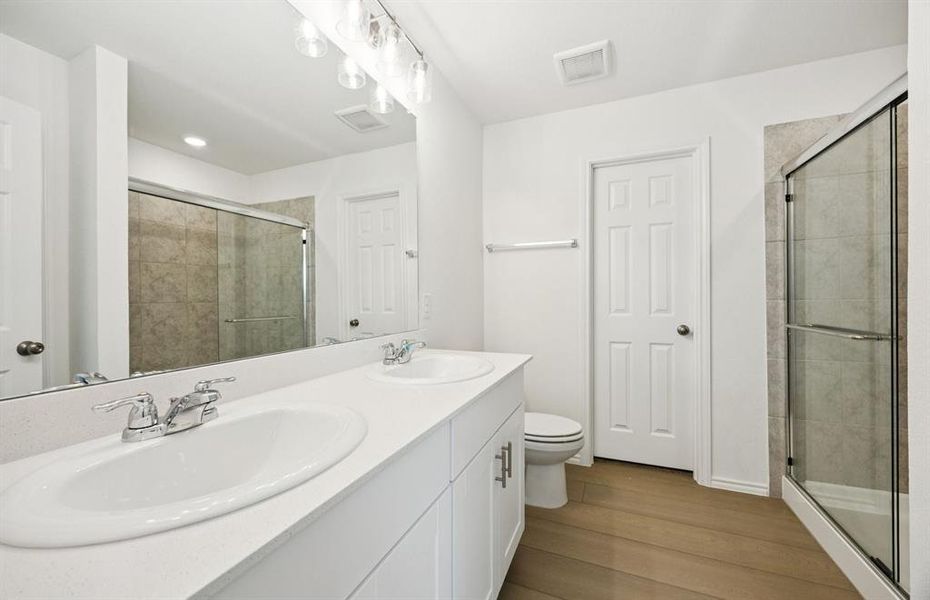 Owner's private bath with double vanity