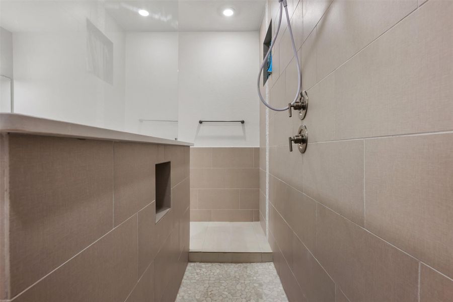 Full bathroom featuring a walk in shower, tile walls, and recessed lighting Full bathroom featuring a walk in shower, tile walls, and recessed lighting