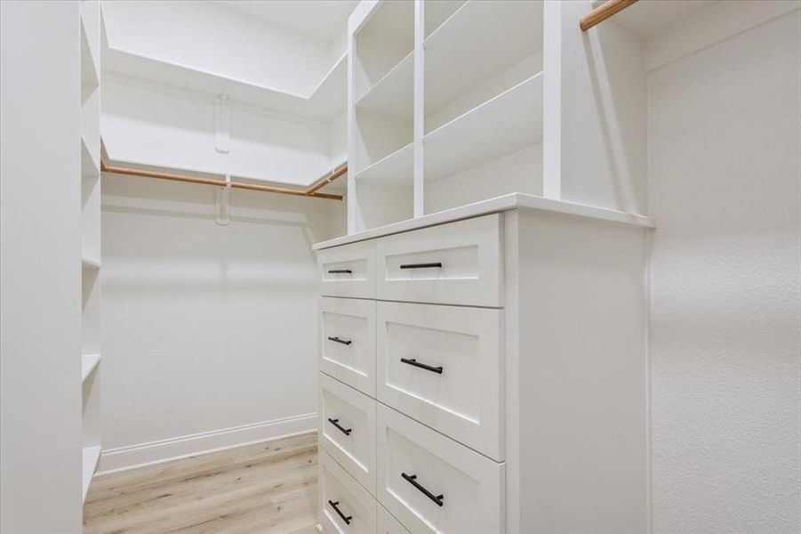Spacious walk-in closet Spacious walk-in closet