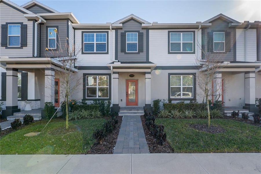 Front exterior of a new home in , Winter Garden, FL, highlighting curb appeal (Image 2). Front exterior of a new home in , Winter Garden, FL, highlighting curb appeal (Image 2).
