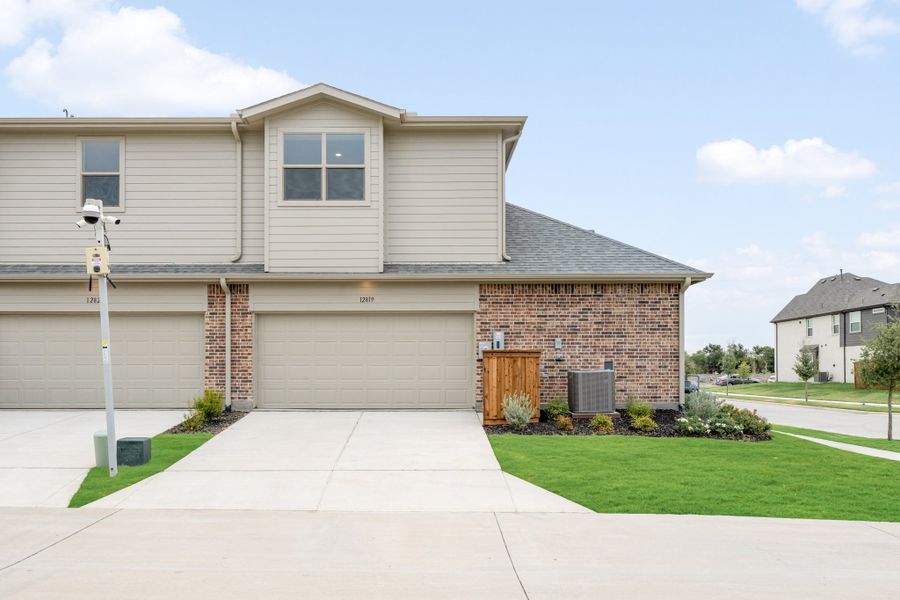 Front exterior of a new home in Cottonwood Creek, Rowlett, TX, highlighting curb appeal (Image 28).
