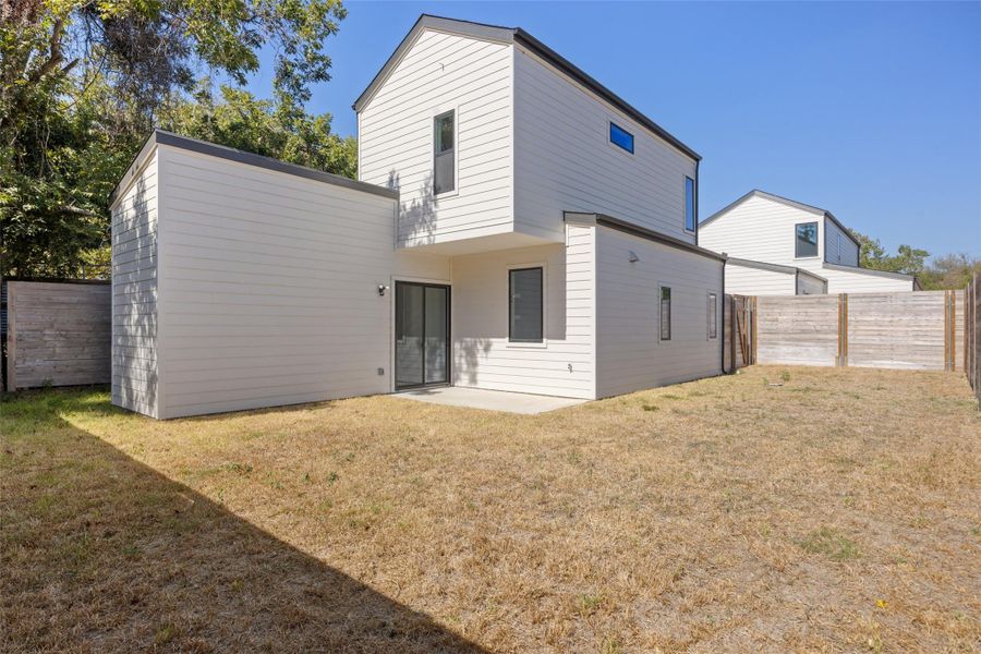 Rear view of property with a fenced backyard and a patio Rear view of property with a fenced backyard and a patio