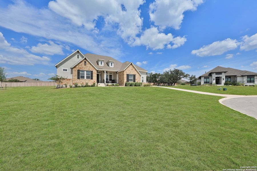 Front exterior of a new home in Megans Landing – Half-Acre Homesites, Castroville, TX, highlighting curb appeal (Image 20). Front exterior of a new home in Megans Landing – Half-Acre Homesites, Castroville, TX, highlighting curb appeal (Image 20).