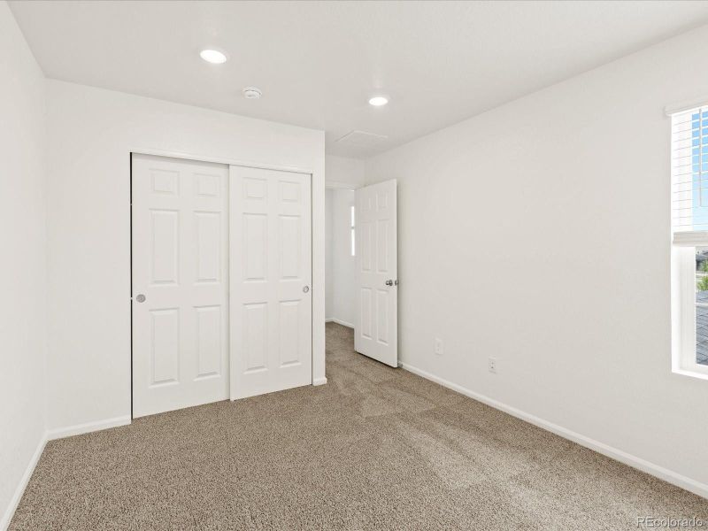 Spacious, unfurnished interior of a new home in Ridgeline Vista: The Flora Collection, Brighton (Image 28).