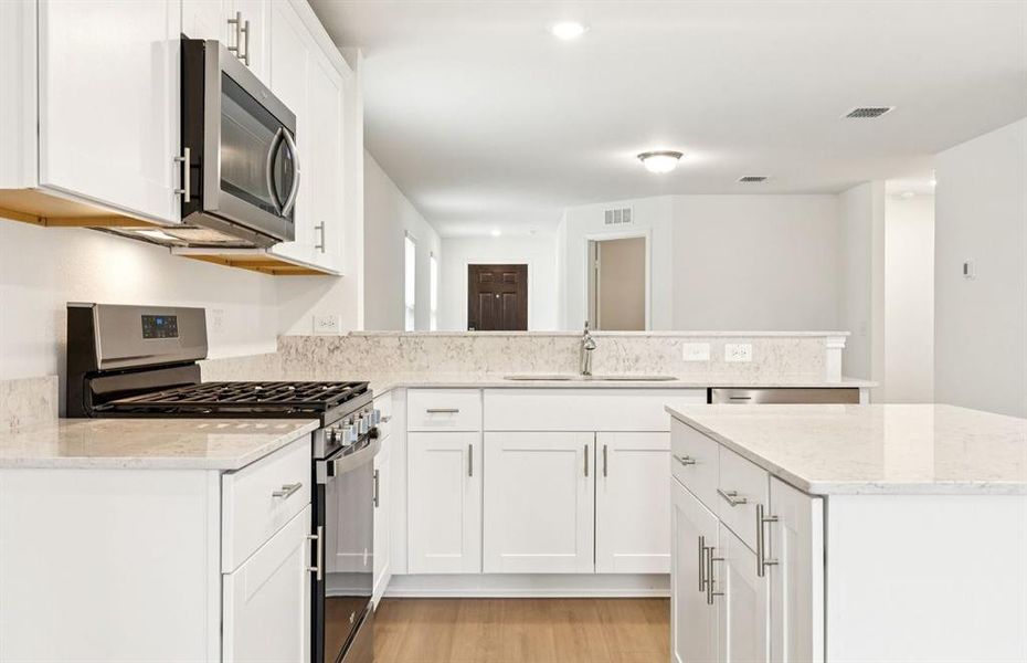 Spacious eat-in kitchen designed with a nice island for dining Spacious eat-in kitchen designed with a nice island for dining