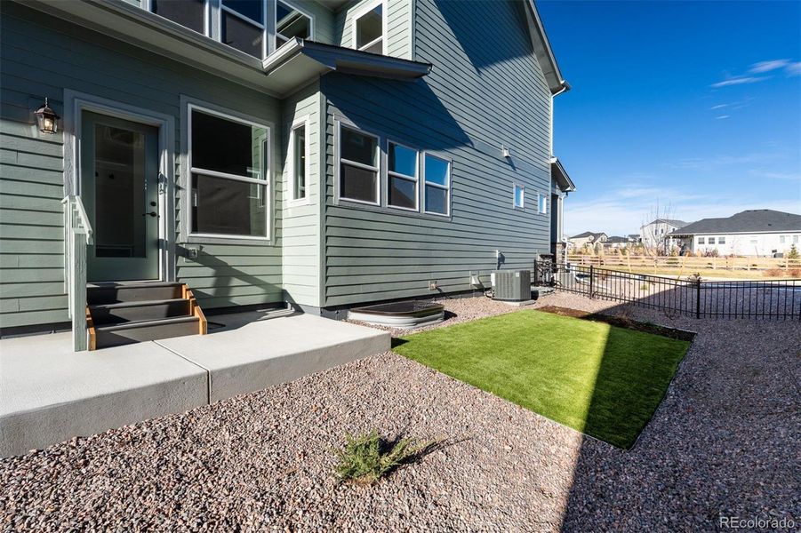 Exterior details and patio area of a home in Revel Crossing at Wolf Ranch – The Outlook Collection, Colorado Springs (Image 3).