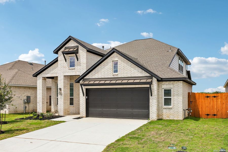 Front exterior of a new home in Stream Waters, Seguin, TX, highlighting curb appeal (Image 1). Front exterior of a new home in Stream Waters, Seguin, TX, highlighting curb appeal (Image 1).