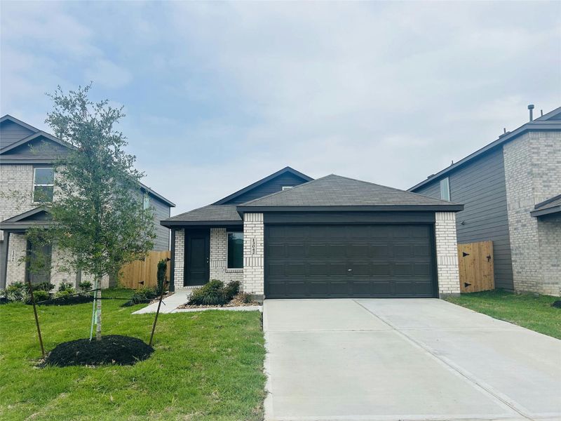 Front exterior of a new home in Sweetgrass Village, Crosby, TX, highlighting curb appeal (Image 1). Front exterior of a new home in Sweetgrass Village, Crosby, TX, highlighting curb appeal (Image 1).
