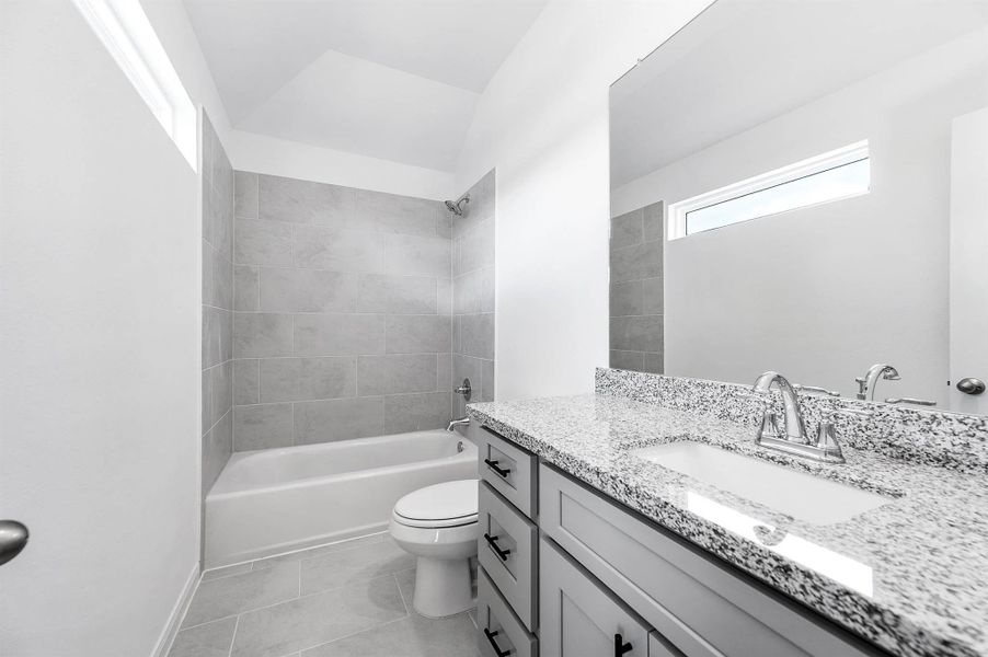 Secondary bathroom complete with a tub/shower combo. Secondary bathroom complete with a tub/shower combo.