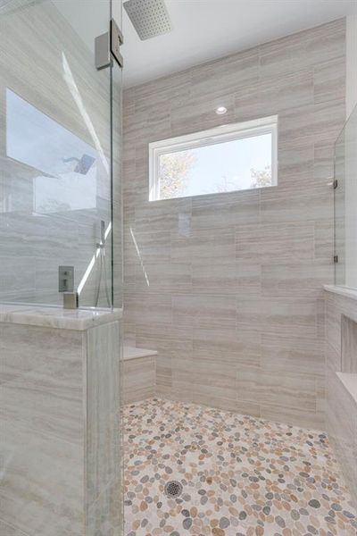 Bathroom featuring a tile shower