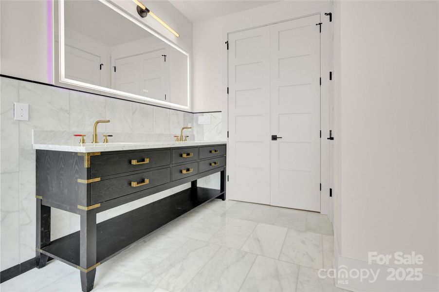 Primary suite dual vanity has LED mirror Primary suite dual vanity has LED mirror