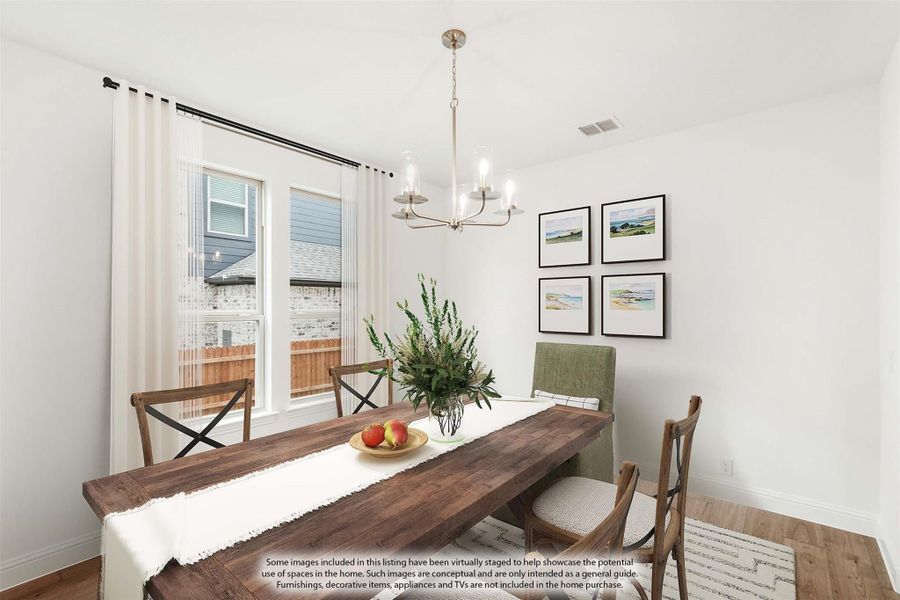 Dining room with wood table, chandelier, hardwood floors, and large windows with white curtains