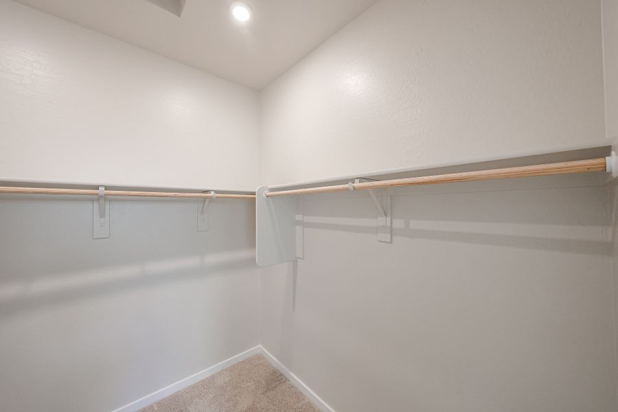 A white wall with a metal bar. A white wall with a metal bar.
