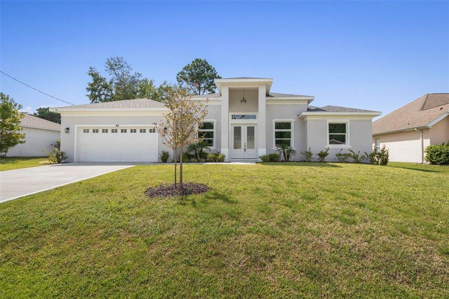 Front exterior of a new home in , Palm Coast, FL, highlighting curb appeal (Image 26).