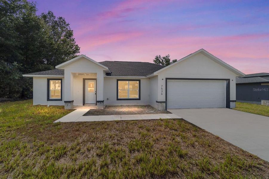 Front exterior of a new home in , Ocala, FL, highlighting curb appeal (Image 2).