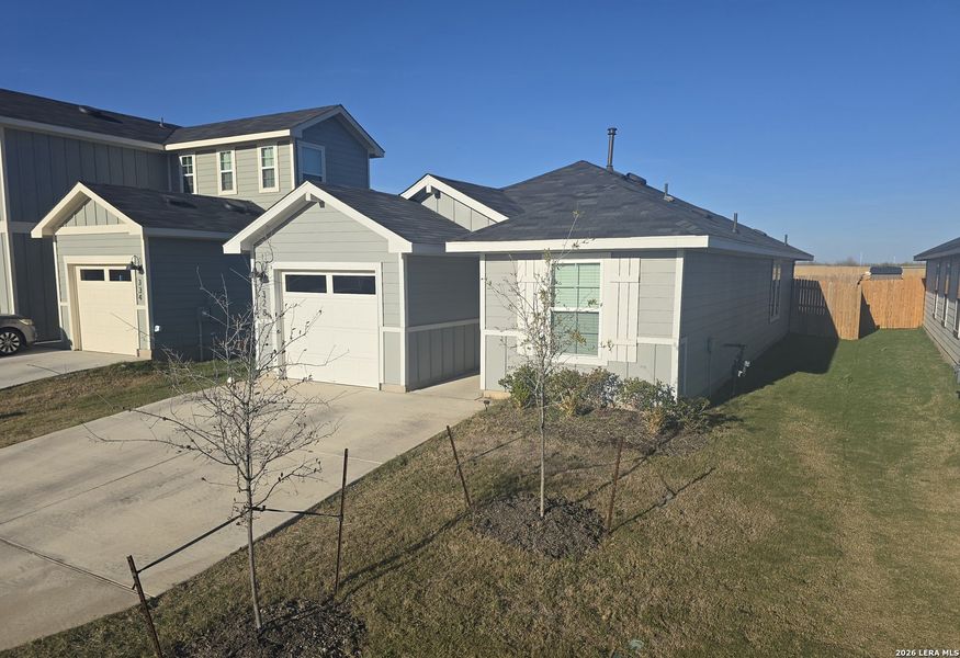 Front exterior of a new home in , Kyle, TX, highlighting curb appeal (Image 22).