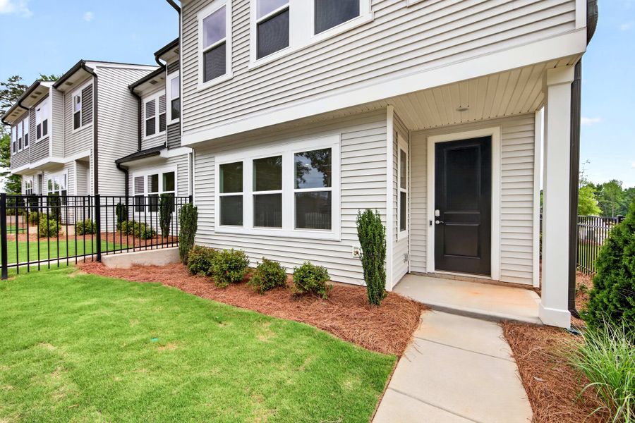Exterior details and patio area of a home in Amplitude, Charlotte (Image 3).