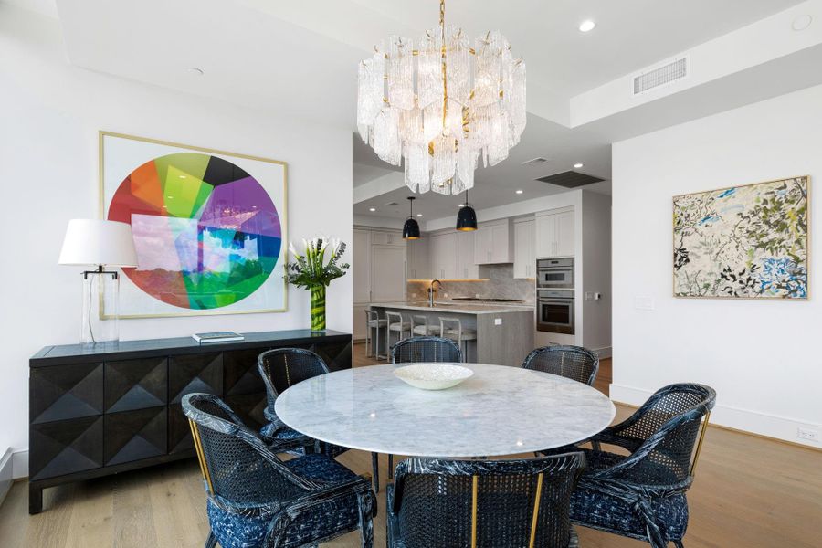 The dining area so close to the kitchen helps to maximize the space and flow.