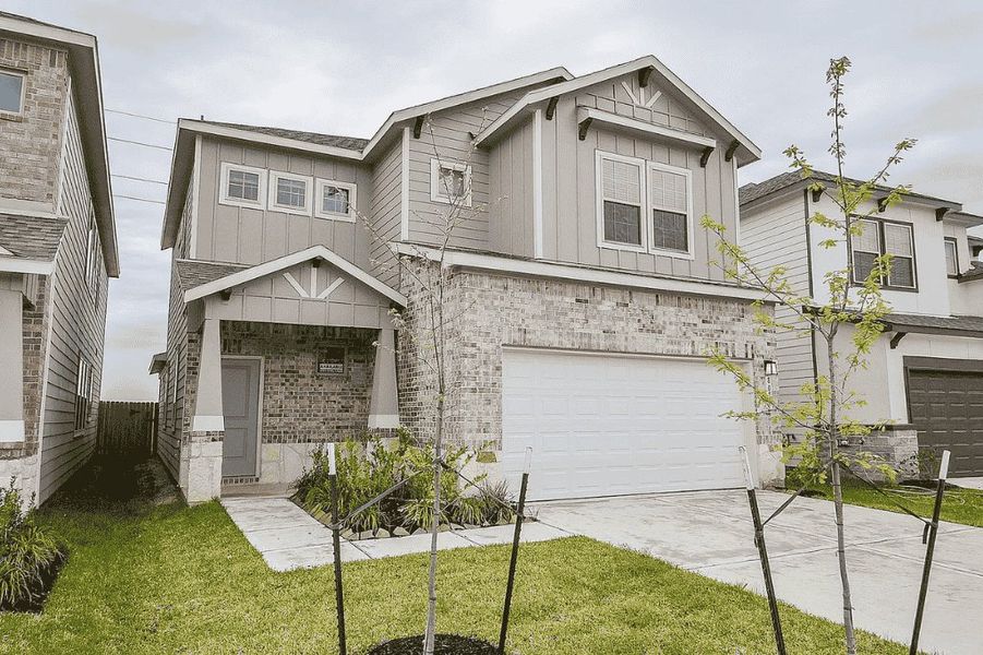 Representative exterior photo of a completed home built from the Laurel by Saratoga Homes in Enclave at Dobbin, Magnolia, TX (Image 2). Representative exterior photo of a completed home built from the Laurel by Saratoga Homes in Enclave at Dobbin, Magnolia, TX (Image 2).