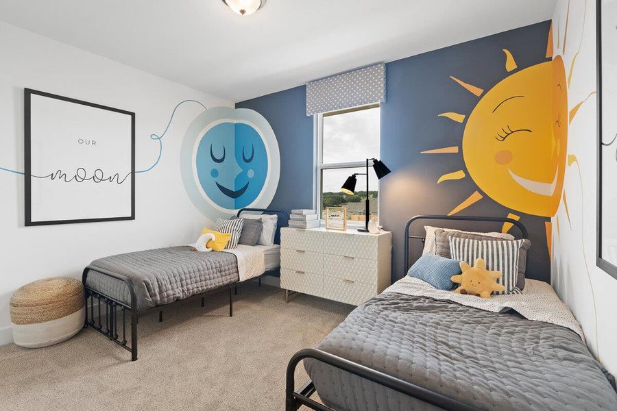 Bedroom with light colored carpet and an accent wall