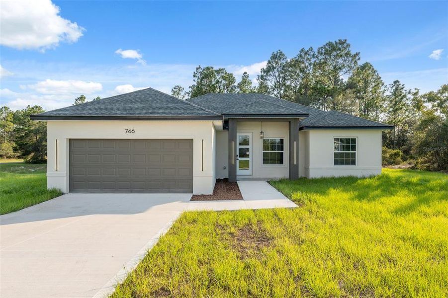 Front exterior of a new home in , Ocala, FL, highlighting curb appeal (Image 19).