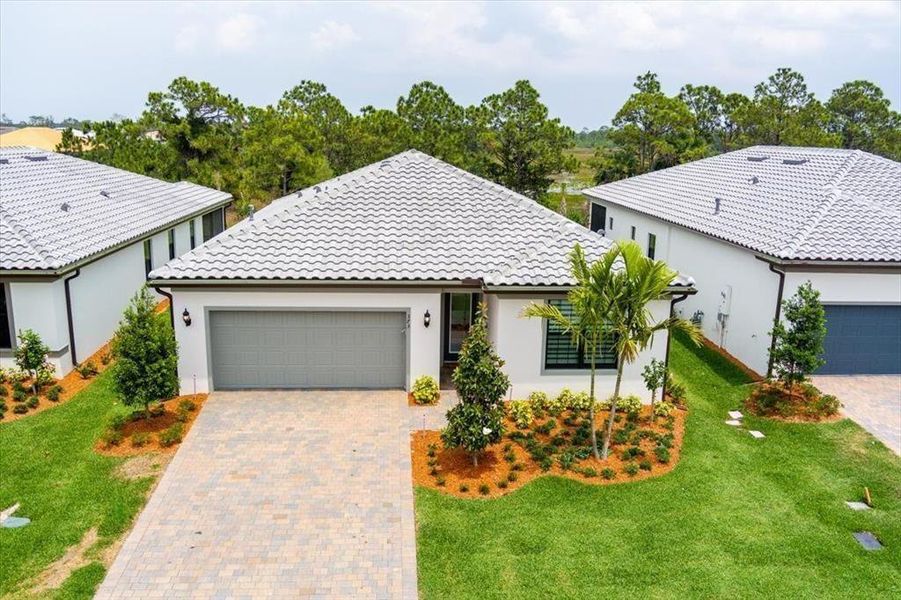 Front exterior of a new home in , Port St. Lucie, FL, highlighting curb appeal (Image 18). Front exterior of a new home in , Port St. Lucie, FL, highlighting curb appeal (Image 18).