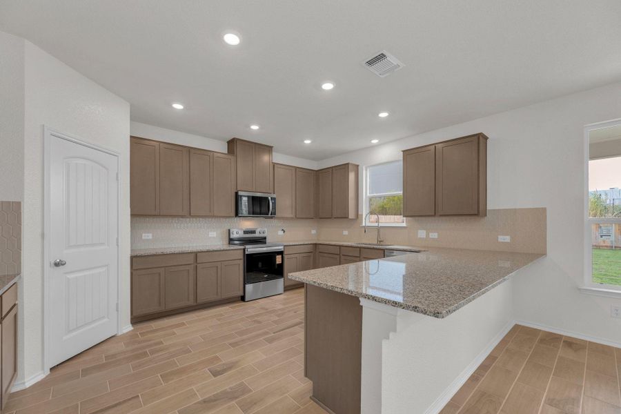 Furnished interior view inside a new home in Mustang Valley, Manor (Image 10).