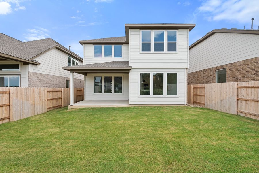 Exterior details and patio area of a home in Lariat, Liberty Hill (Image 32).