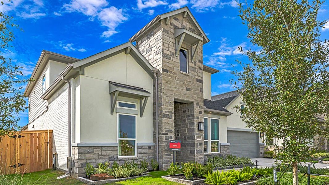 Representative exterior photo of a completed home built from the Topaz by Taylor Morrison in Avalon at Cypress 60s, Cypress, TX (Image 23). Representative exterior photo of a completed home built from the Topaz by Taylor Morrison in Avalon at Cypress 60s, Cypress, TX (Image 23).