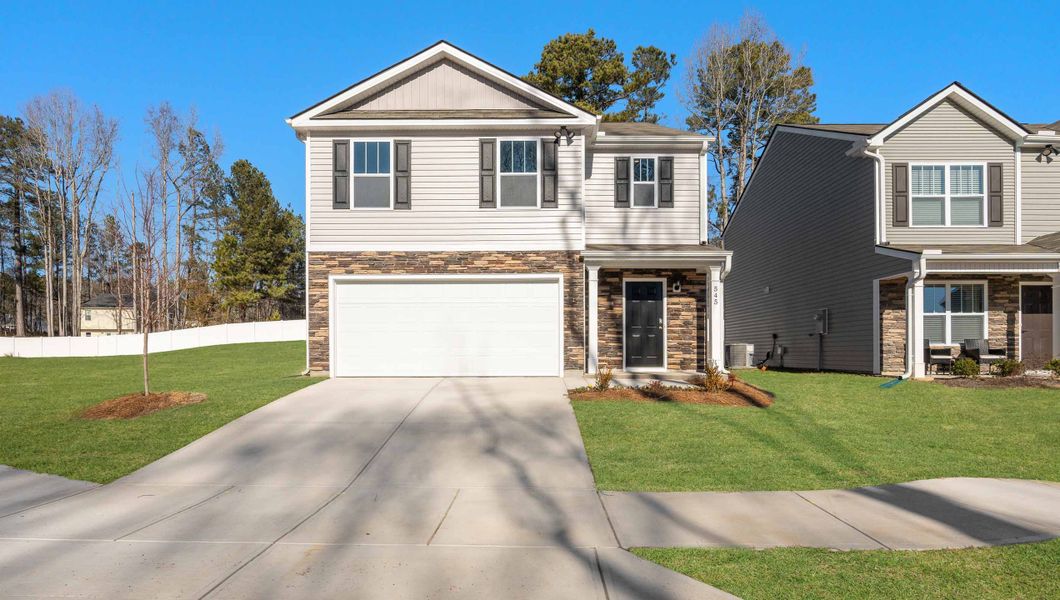 Front exterior of a new home in Baxter Village, Boiling Springs, SC, highlighting curb appeal (Image 1).