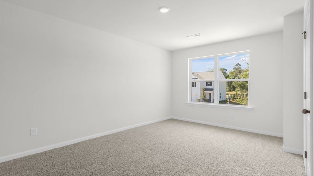 Spacious, unfurnished interior of a new home in The Townes at Belle Grove, Wendell (Image 22).