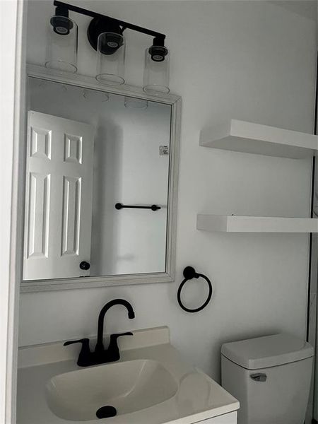 Bathroom with toilet and vanity