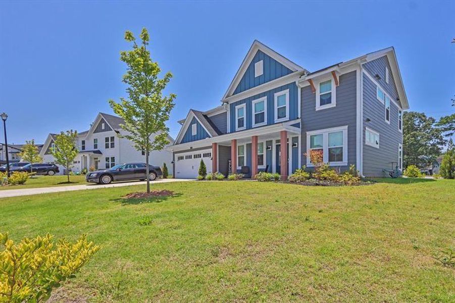 Front exterior of a new home in Sweetbay Farm, Lawrenceville, GA, highlighting curb appeal (Image 20).