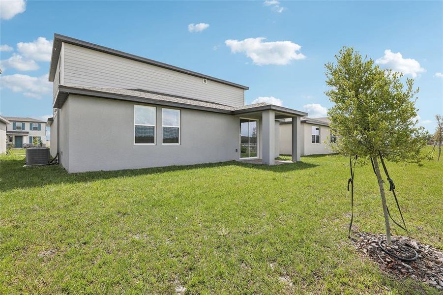 Exterior details and patio area of a home in The Meadow at Crossprairie, St. Cloud (Image 27).