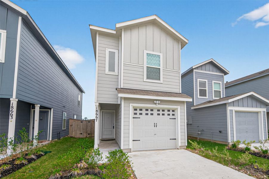 Front exterior of a new home in Tavola, New Caney, TX, highlighting curb appeal (Image 1). Front exterior of a new home in Tavola, New Caney, TX, highlighting curb appeal (Image 1).