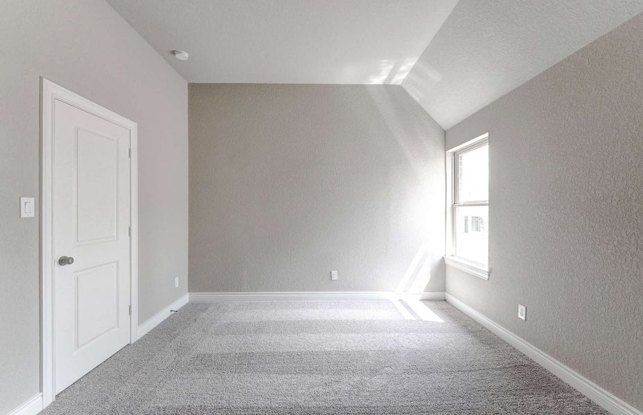 Representative unfurnished interior of a home built from the 3799 by Ravenna Homes in Artavia 70′, Conroe (Image 50).