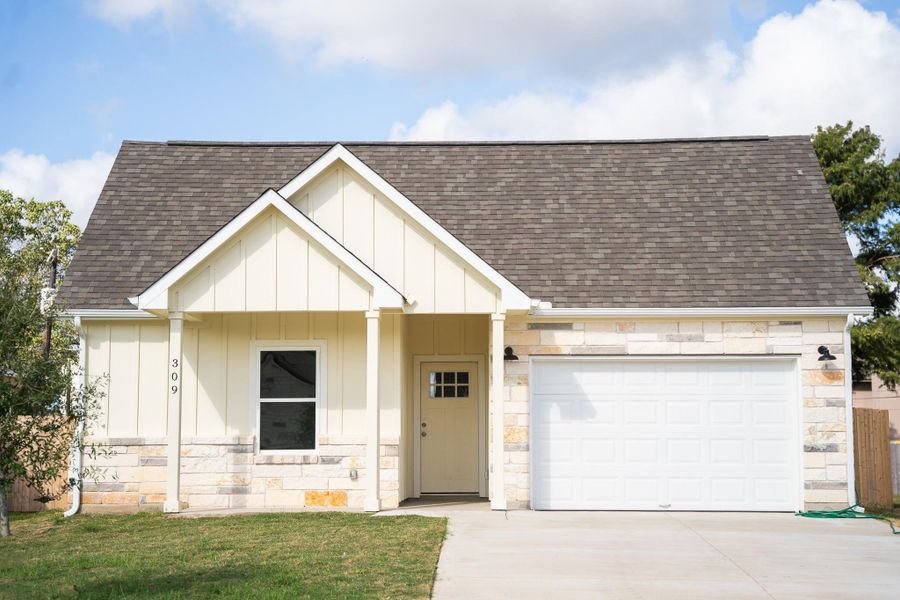 Front exterior of a new home in , Smithville, TX, highlighting curb appeal (Image 19). Front exterior of a new home in , Smithville, TX, highlighting curb appeal (Image 19).