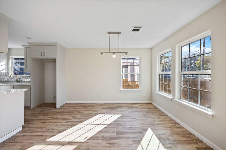 Dining area positioned next to the kitchen, providing a seamless flow for entertaining and daily meals.