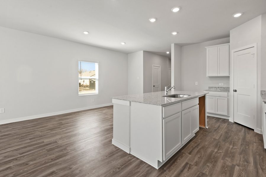 A kitchen with white cabinets. A kitchen with white cabinets.