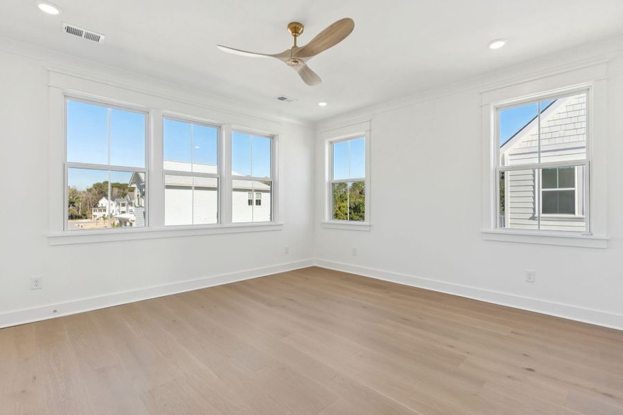 Spacious, unfurnished interior of a new home in Overlook at Copahee Sound, Awendaw (Image 58).