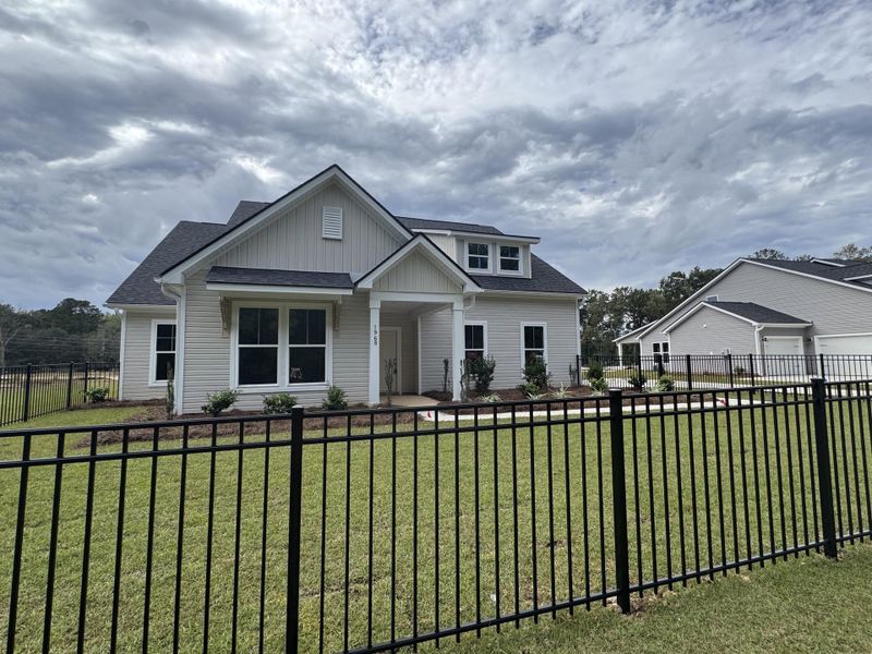 Front exterior of a new home in Central Estates, Summerville, SC, highlighting curb appeal (Image 22).