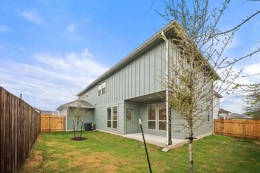 Front exterior of a new home in The Hills of Bear Creek, Manchaca, TX, highlighting curb appeal (Image 23). Front exterior of a new home in The Hills of Bear Creek, Manchaca, TX, highlighting curb appeal (Image 23).