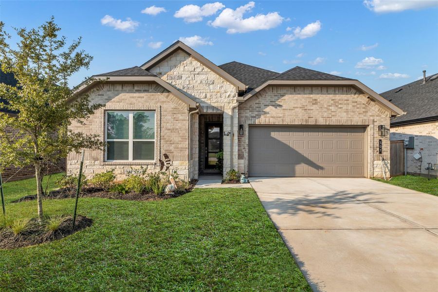 Front exterior of a new home in , Conroe, TX, highlighting curb appeal (Image 1).