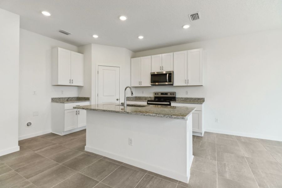 Kitchen of the Bluebell plan in Lakes at Bella Lago.