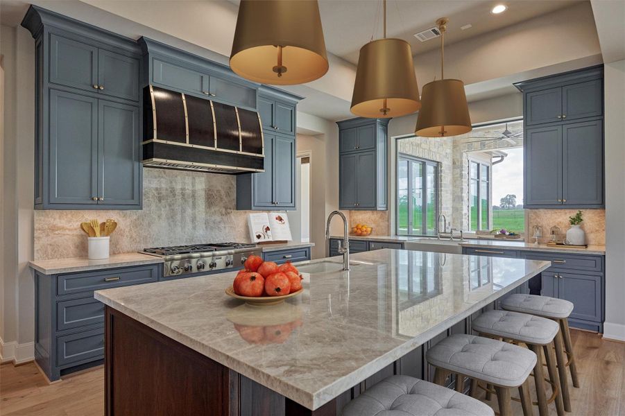 Large kitchen, massive island, massive walk-in pantry, two sinks, large window overlooking outdoor living. Photo is virtually staged/enhanced. Large kitchen, massive island, massive walk-in pantry, two sinks, large window overlooking outdoor living. Photo is virtually staged/enhanced.