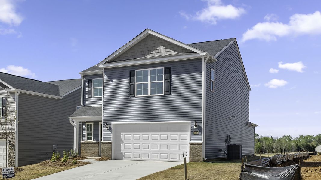 Front exterior of a new home in Chandler Pointe, Rural Hall, NC, highlighting curb appeal (Image 13).