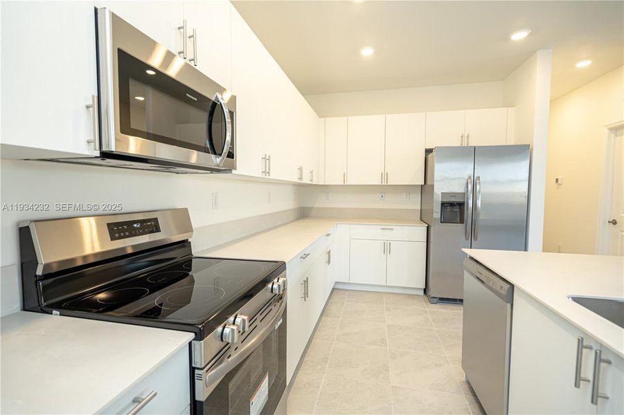Furnished interior view inside a new home in Acacia Groves, Miami (Image 11).