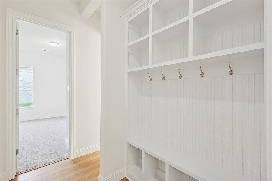 Mudroom featuring wood-type flooring